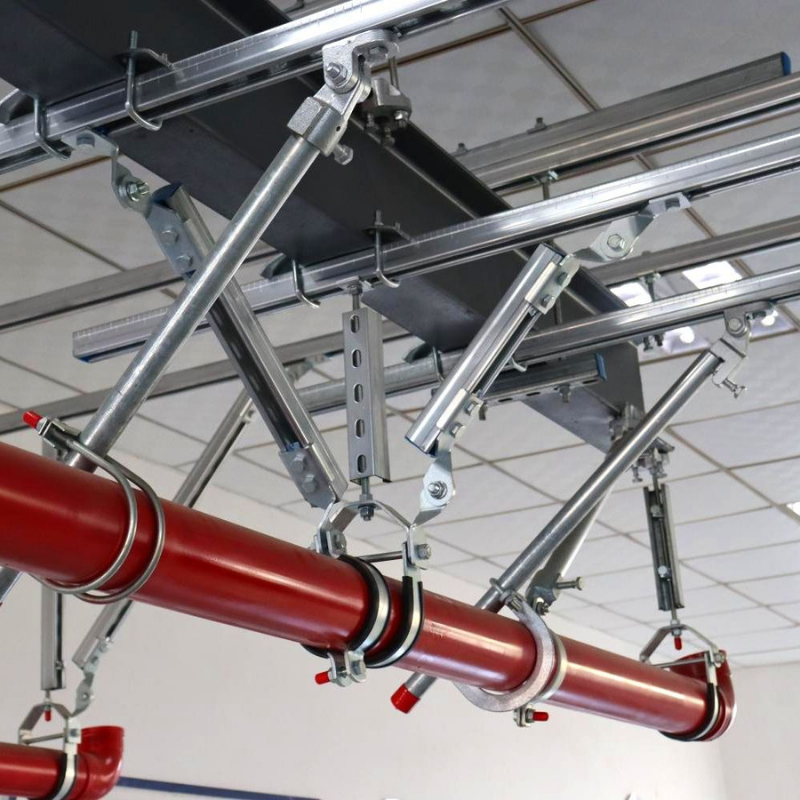 Seismic bracing system for suspended fire sprinkler and mechanical piping in a commercial building